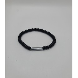 Bracelet noir spiralé avec anneau métal argenté. Bijou moderne, minimaliste et masculin en acier inoxydable.